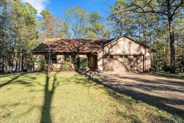 ranch-style home featuring a front yard and a garage