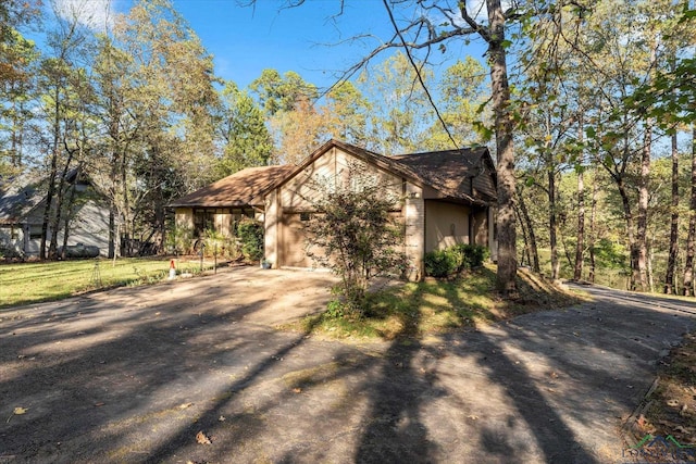 view of side of home with a garage