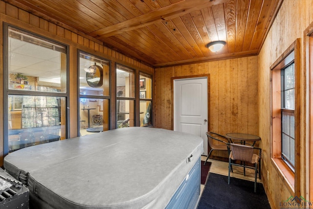 interior space with beamed ceiling and wooden ceiling