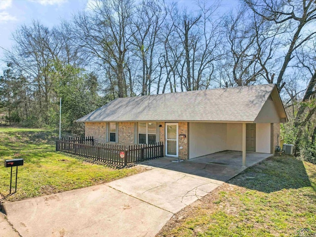 ranch-style home with central AC unit, a fenced front yard, a shingled roof, driveway, and stucco siding