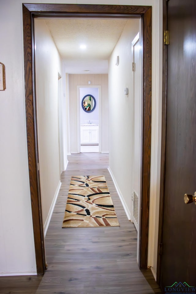 1508 Miami Dr, Longview, TX 75601 - hallway with wood finished floors and baseboards