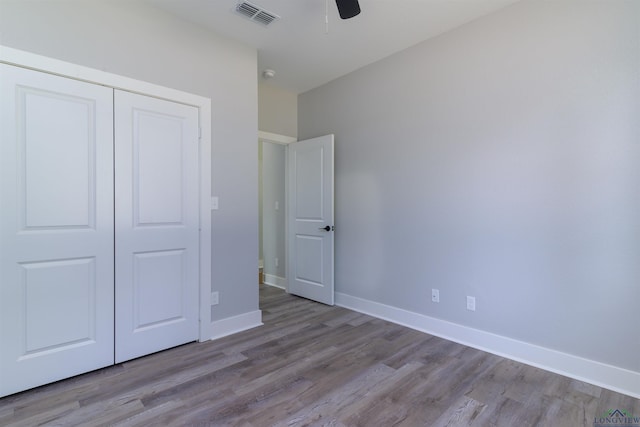 unfurnished bedroom featuring a closet, ceiling fan, and light hardwood / wood-style floors