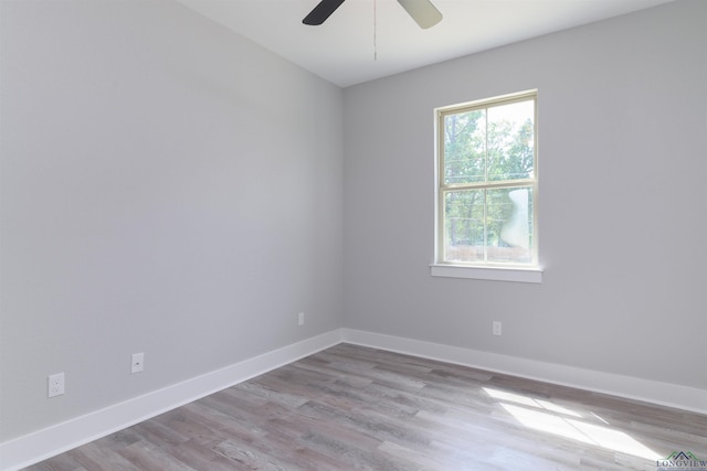 unfurnished room with light hardwood / wood-style floors and ceiling fan