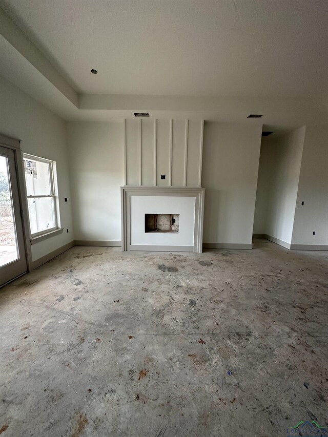 unfurnished living room with a fireplace