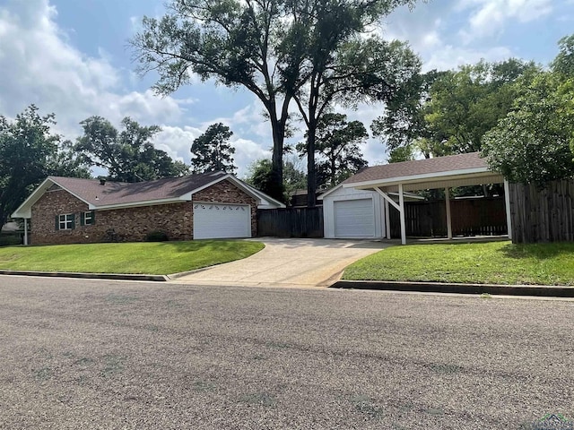 201 Mockingbird Ln, Longview, TX 75601 - view of front of house with concrete driveway, an attached garage, and brick siding