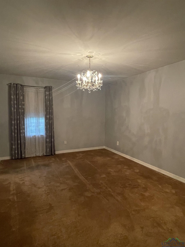 201 Mockingbird Ln, Longview, TX 75601 - carpeted spare room with a chandelier and baseboards