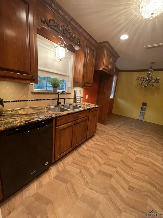 201 Mockingbird Ln, Longview, TX 75601 - kitchen featuring black dishwasher, a chandelier, decorative backsplash, dark stone countertops, and recessed lighting