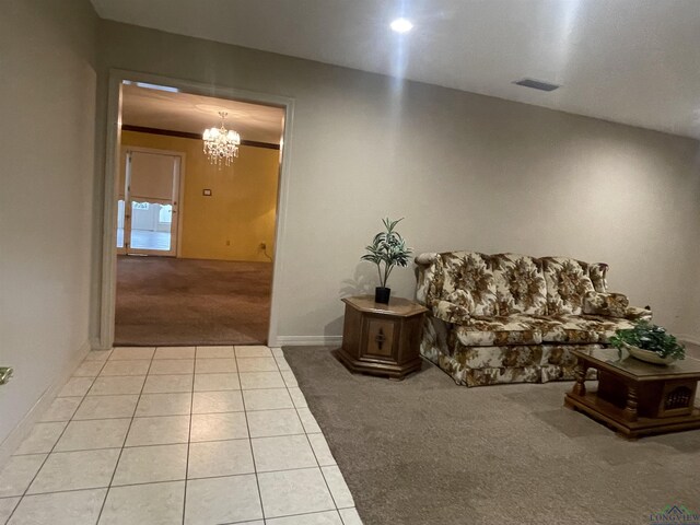 201 Mockingbird Ln, Longview, TX 75601 - carpeted living area with a chandelier and tile patterned floors