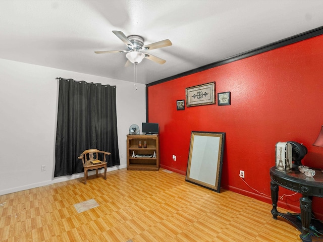 misc room featuring light hardwood / wood-style flooring, ceiling fan, and crown molding