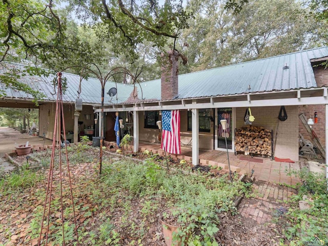 back of house featuring a patio