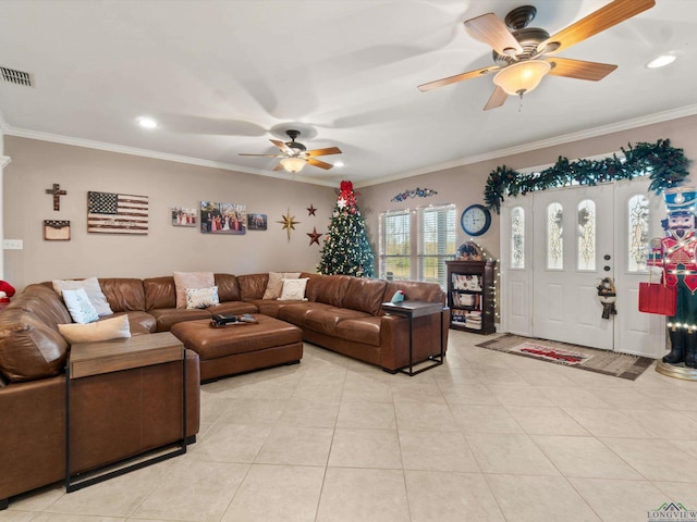 tiled living room featuring ceiling fan and ornamental molding