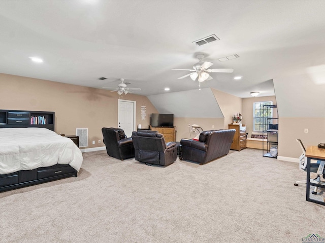 bedroom with vaulted ceiling, light carpet, and ceiling fan