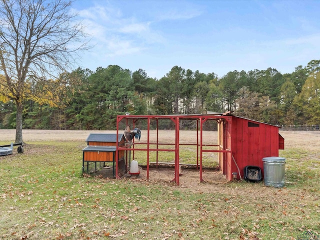 view of playground featuring an outbuilding and a lawn