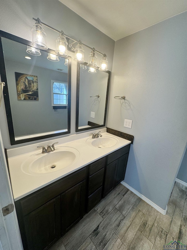 bathroom featuring vanity and wood-type flooring