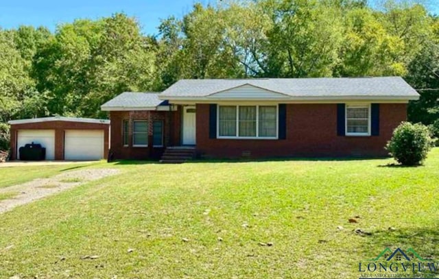 ranch-style home with a garage and a front lawn