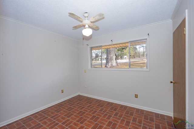 unfurnished room featuring ceiling fan, ornamental molding, and a textured ceiling