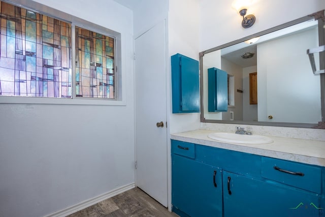 bathroom featuring hardwood / wood-style flooring and vanity