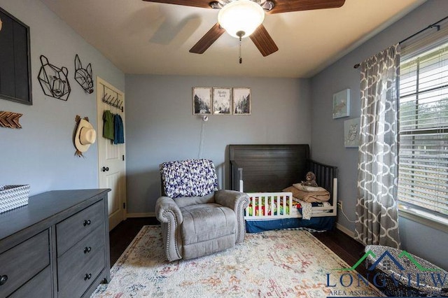 bedroom featuring ceiling fan and dark hardwood / wood-style flooring