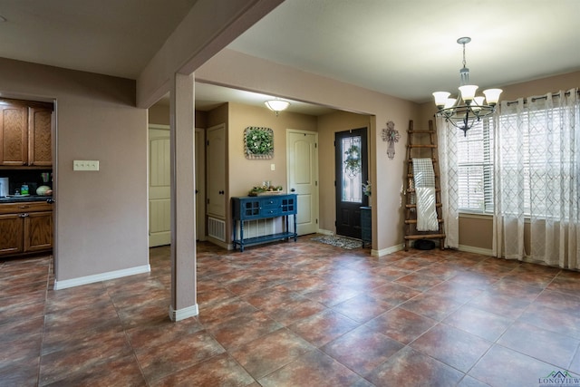 unfurnished dining area featuring a notable chandelier