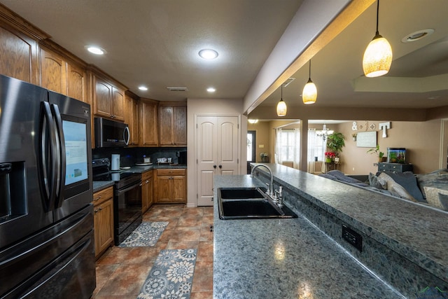 kitchen featuring decorative light fixtures, black electric range, decorative backsplash, sink, and fridge with ice dispenser