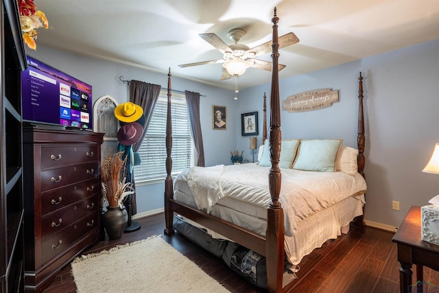 bedroom featuring ceiling fan and dark hardwood / wood-style floors