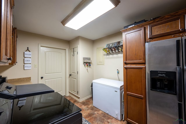 laundry area featuring cabinets and washer and clothes dryer