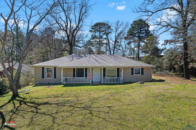 ranch-style home with a front yard and covered porch