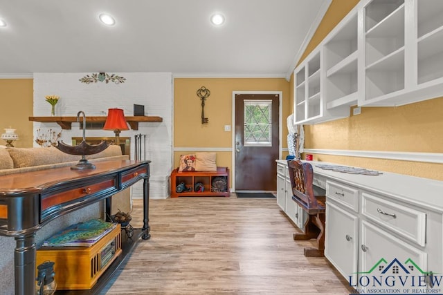kitchen with crown molding, recessed lighting, light wood finished floors, and white cabinetry