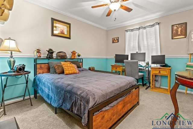 carpeted bedroom with baseboards, ornamental molding, and a ceiling fan
