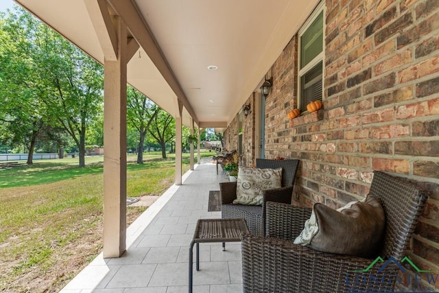 view of patio featuring a porch