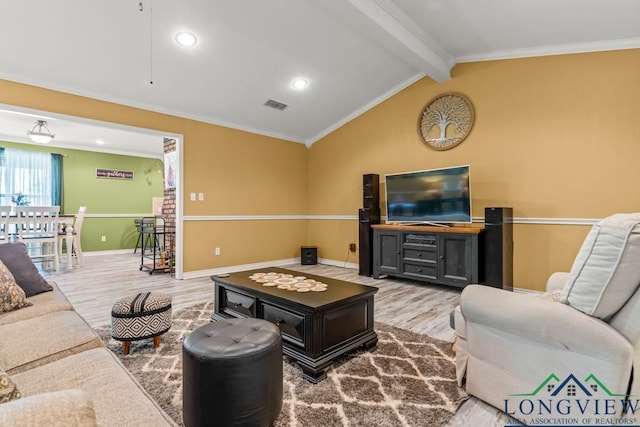 living area featuring visible vents, baseboards, wood finished floors, and vaulted ceiling with beams