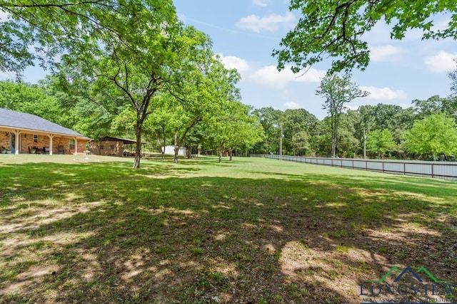 view of yard featuring fence