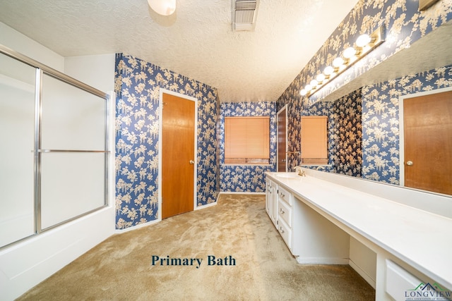 bathroom with vanity and a textured ceiling