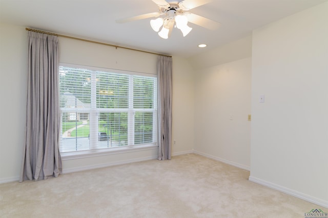 unfurnished room featuring light carpet, ceiling fan, and lofted ceiling