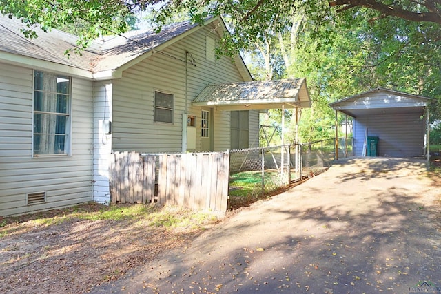 view of property exterior with a carport