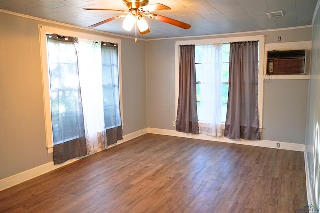 spare room with dark hardwood / wood-style floors, ceiling fan, crown molding, and a wall mounted AC