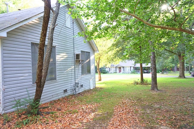 view of property exterior with a wall mounted air conditioner