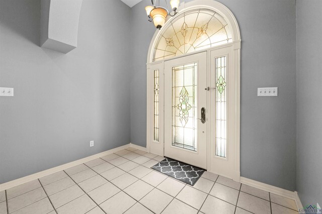 1804 W Lake Dr, Gladewater, TX 75647 - tiled entrance foyer featuring plenty of natural light and a notable chandelier