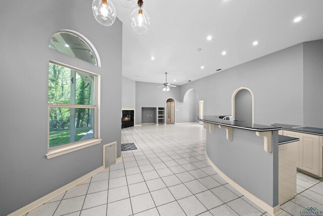 1804 W Lake Dr, Gladewater, TX 75647 - living room with ceiling fan and light tile patterned flooring