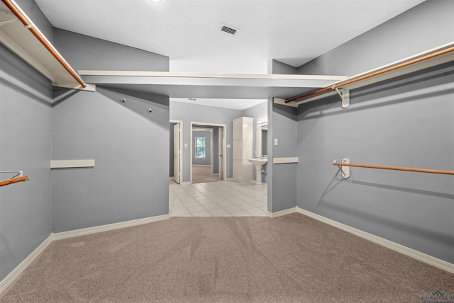 1804 W Lake Dr, Gladewater, TX 75647 - spacious closet featuring light colored carpet