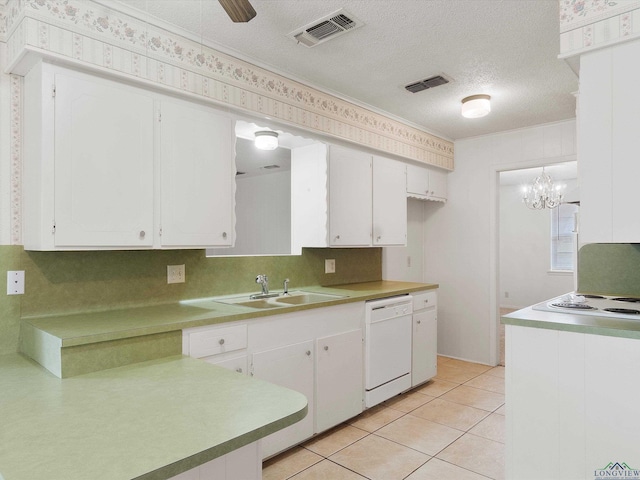 kitchen featuring white cabinets, sink, white dishwasher, and pendant lighting