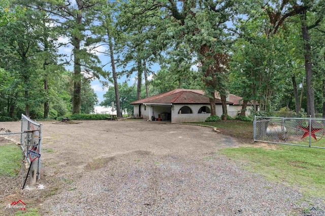 453 Wiggins Rd, Karnack, TX 75661 - view of front of house with driveway