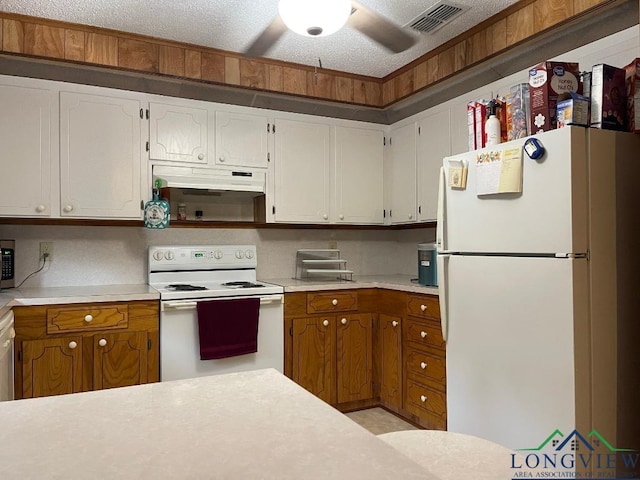 kitchen with ceiling fan, a textured ceiling, and appliances with stainless steel finishes