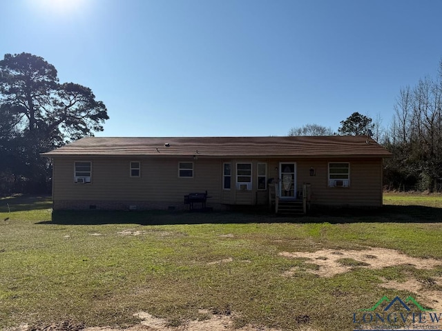 rear view of house with a lawn