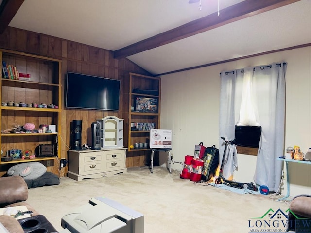 carpeted living room featuring lofted ceiling with beams, wooden walls, and built in shelves