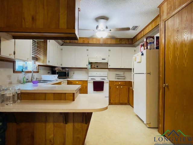 kitchen with white cabinetry, ceiling fan, kitchen peninsula, a textured ceiling, and white appliances