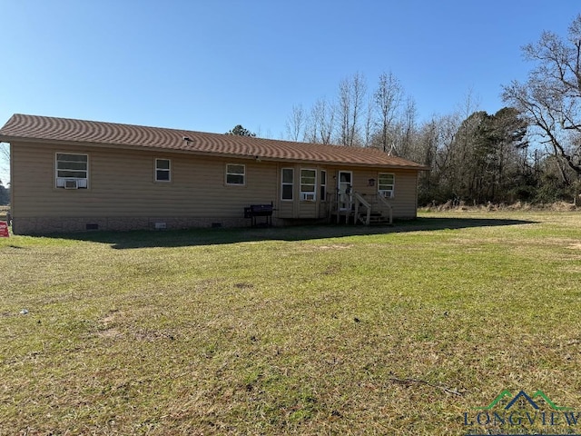 back of property featuring a lawn