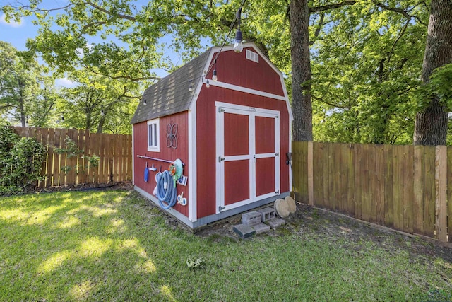 view of shed with a fenced backyard