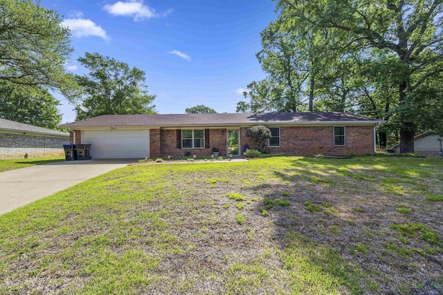 single story home featuring concrete driveway, a front lawn, brick siding, and a garage