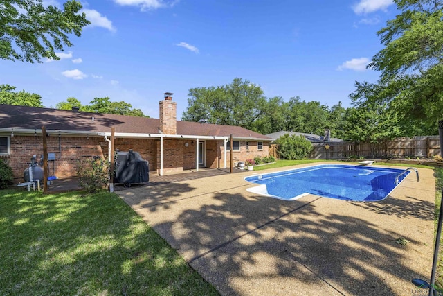 view of swimming pool featuring a fenced backyard, grilling area, a yard, a patio, and a fenced in pool